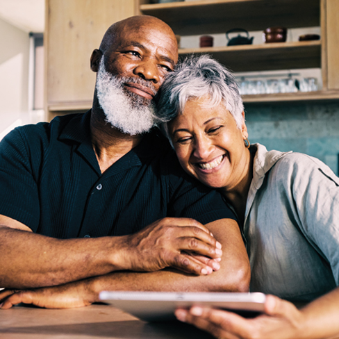 A couple researching planned giving options on their tablet. Link to Life Stage Gift Planner Ages 45-65 Situations. lsgp_45-65.jpg
